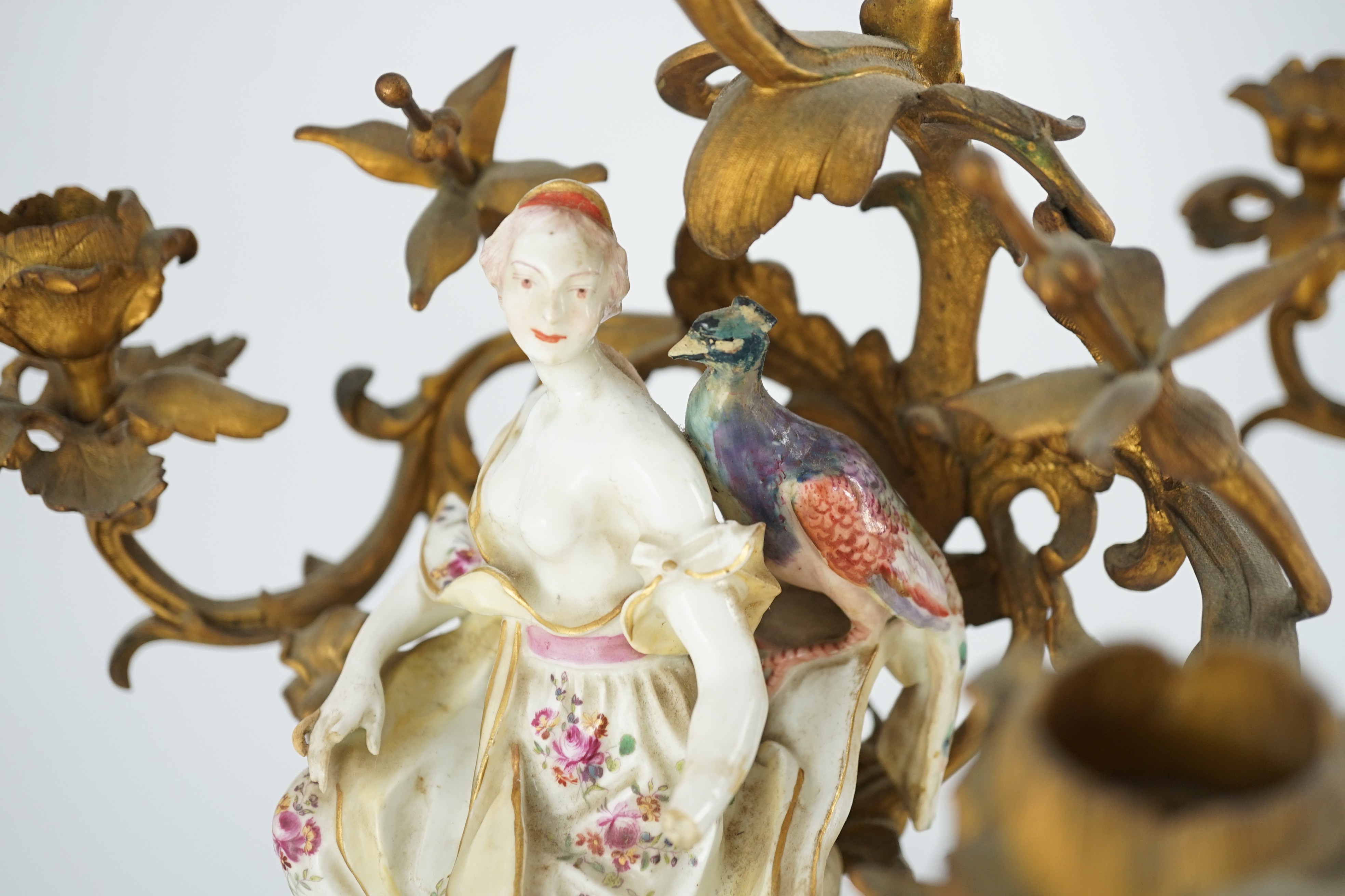 A pair of large Derby porcelain and ormolu mounted ‘Juno and Jupiter’ figural candelabra, the figures c.1760